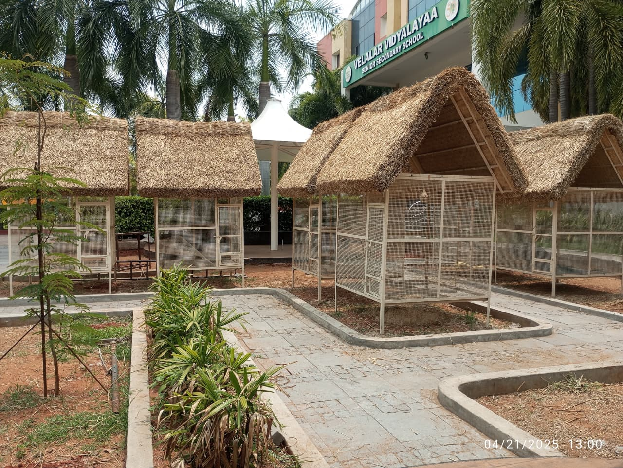 Small wooden garden hut with a thatched palm roof